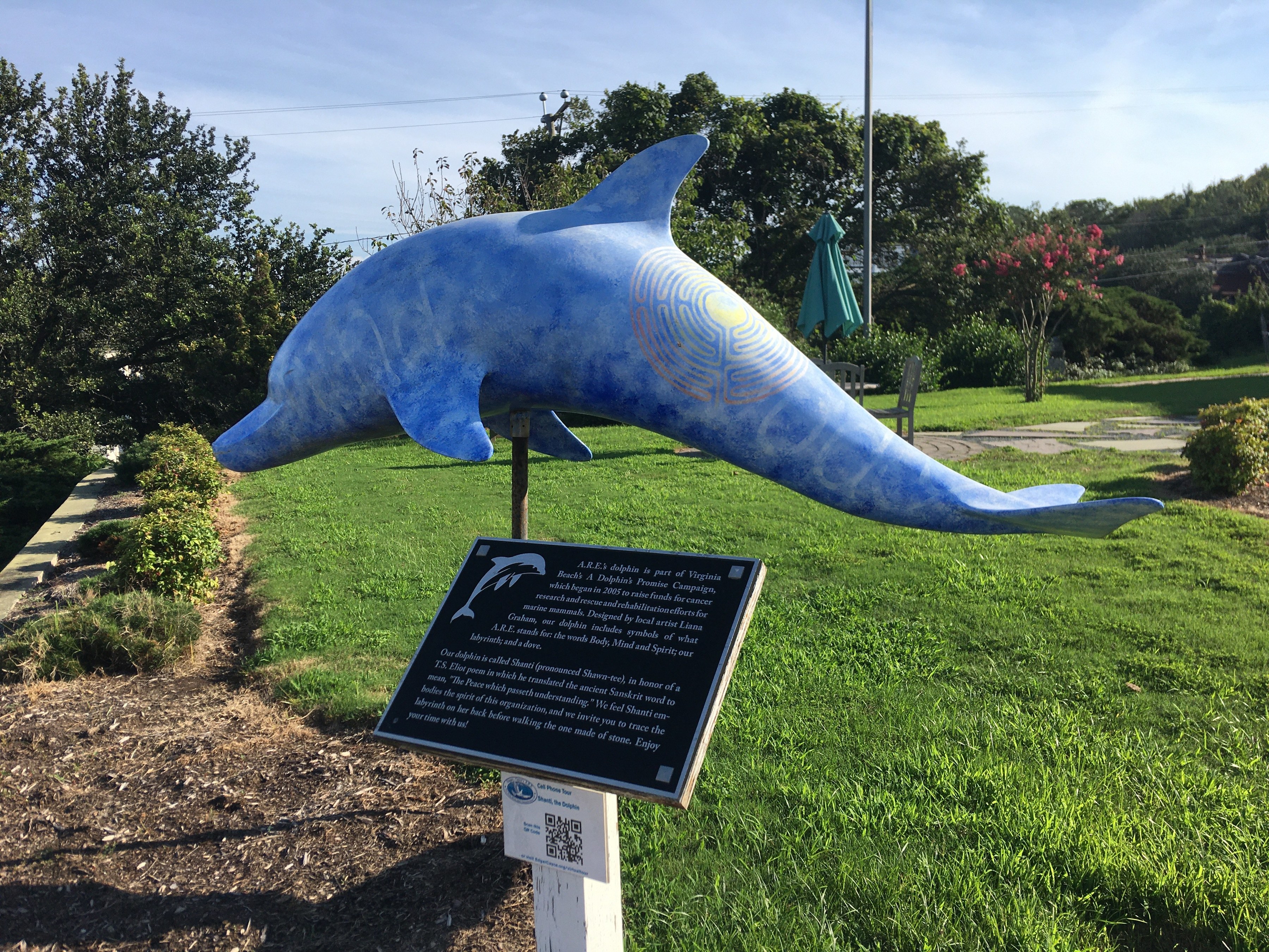 outdoor concrete dolphin statues