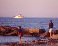 Nantucket jetties beach with Nantucket Ferry in the background.