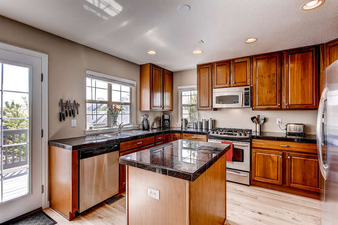 LIVE in Stapleton in this Southwest Facing End Unit ...